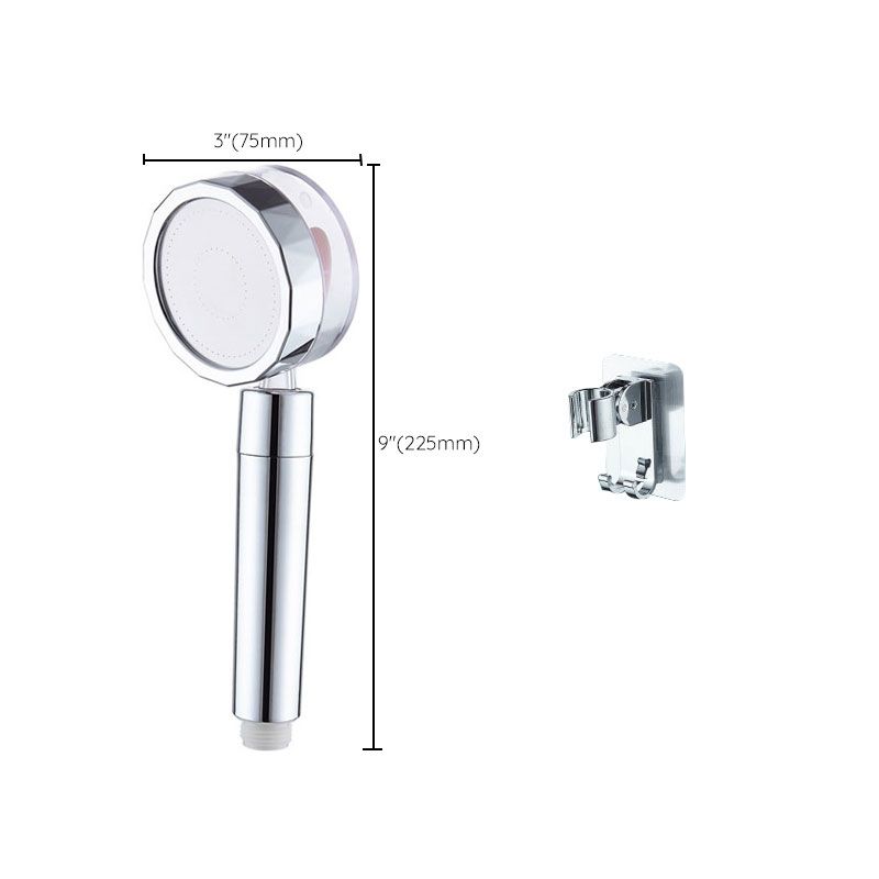 Set with round silver handheld shower head for wall mounting
