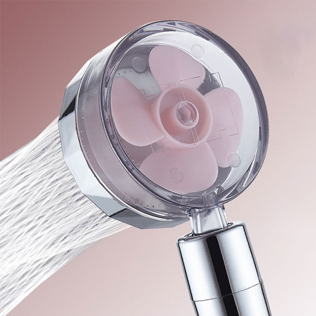 Set with round silver handheld shower head for wall mounting