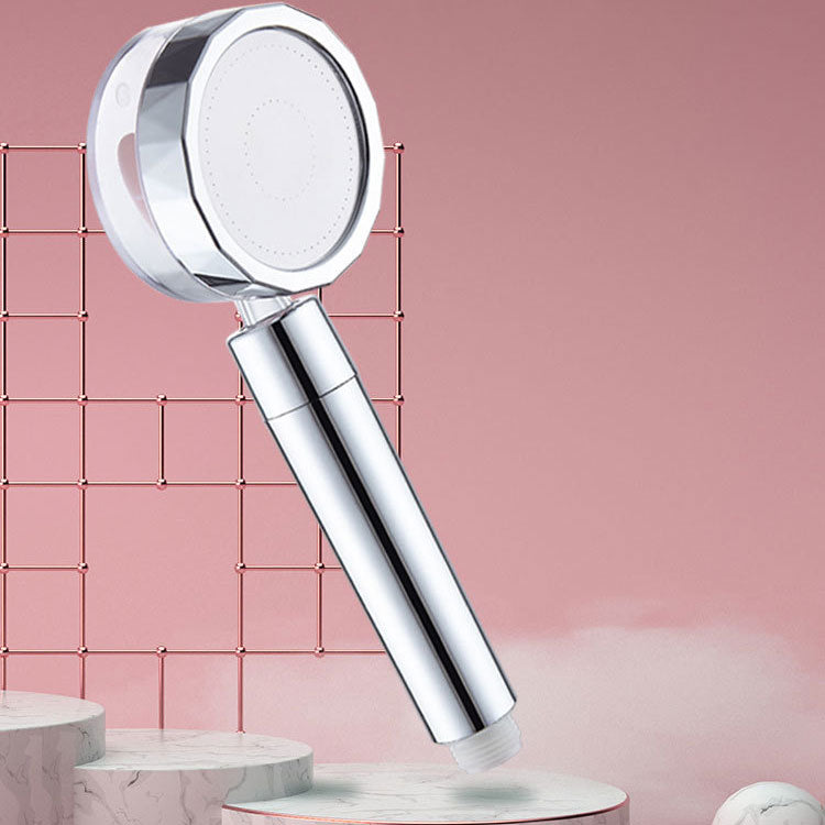Set with round silver handheld shower head for wall mounting