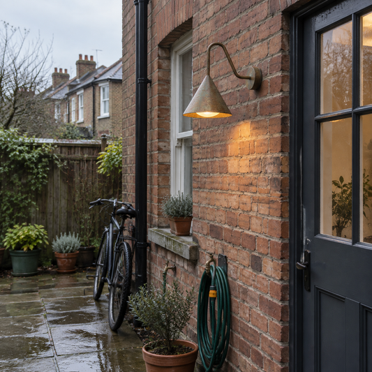 Bell outdoor wall sconce by the back door of a Victorian terrace