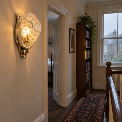 Antique Art Deco brass wall light on a Victorian landing
