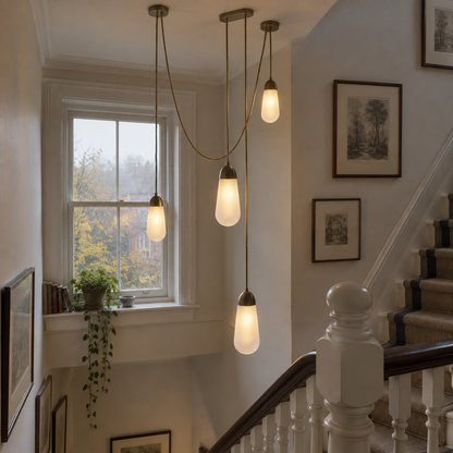 Cascade glass pendant light hanging in a stairwell