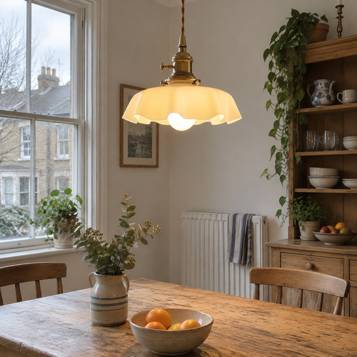 Cream glass scalloped pendant light over a kitchen table
