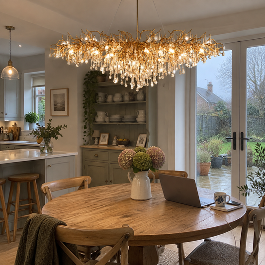 Gold crystal raindrop chandelier over a kitchen dining table