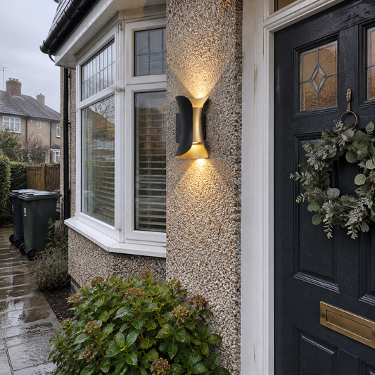 Curved up and down wall light by a front door