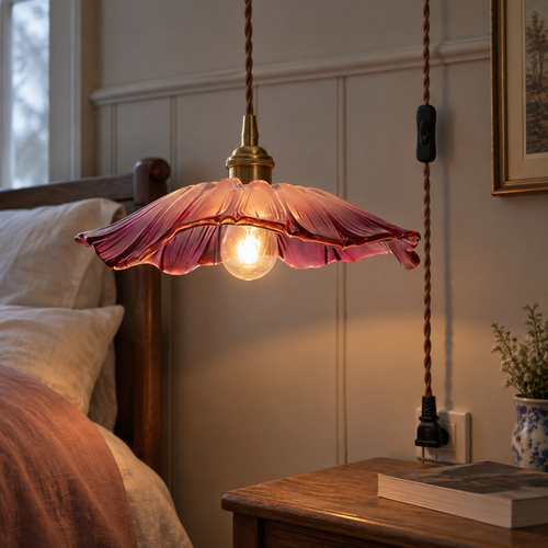 Plug in flower glass pendant lamp beside a bed