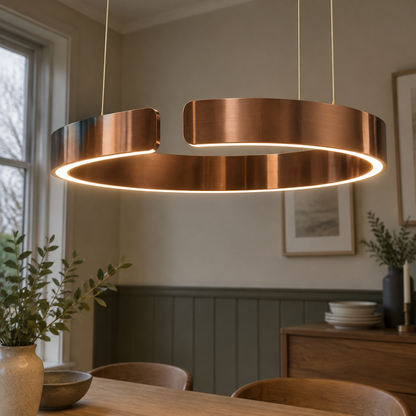 Circular LED ring pendant light hanging above a dining table on a grey afternoon