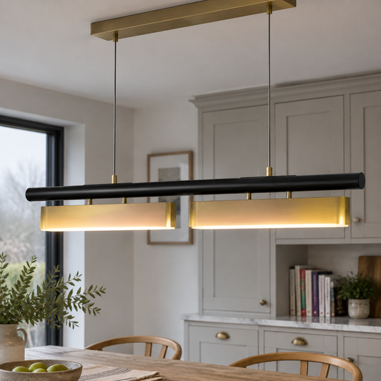Acrylic and metal linear LED chandelier suspended above a British kitchen-diner table