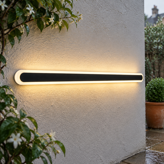 Dimmable linear LED outdoor wall lamp on a British garden wall in misty light