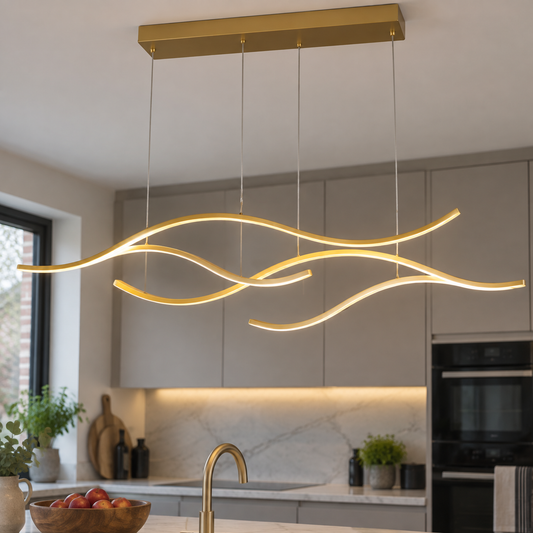 Long linear LED pendant light hanging above a British kitchen island on an overcast day