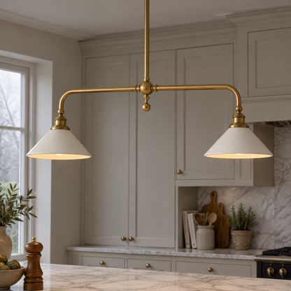 Brass and ceramic linear pendant lamp hanging over a British kitchen island