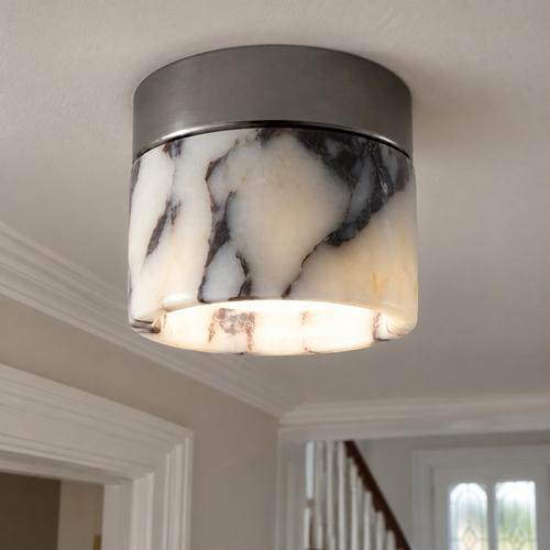 Round marble minimalist flush mount ceiling light fitted to a British hallway ceiling