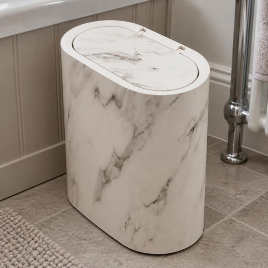 Marble-effect bathroom bin with lid beside a basin in a British bathroom