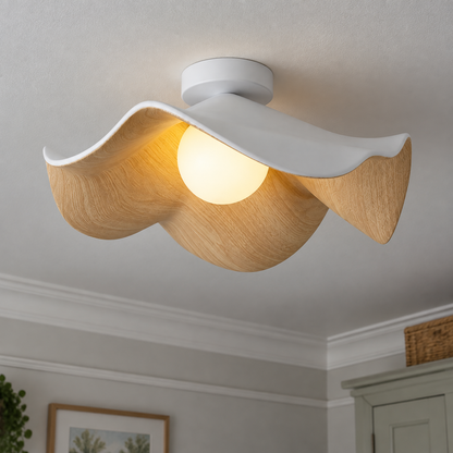 Minimalist ceiling light fitted flush to the ceiling of a British bedroom