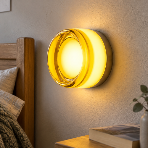 Integrated LED wall lamp mounted beside a bed in a British bedroom