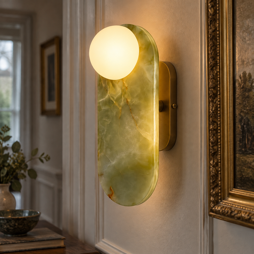 Onyx wall lamp with a jade glass panel glowing on a panelled hallway wall