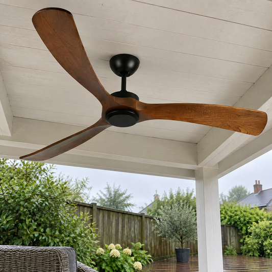 Outdoor ceiling fan with walnut wood blades fitted under a covered patio roof after rain