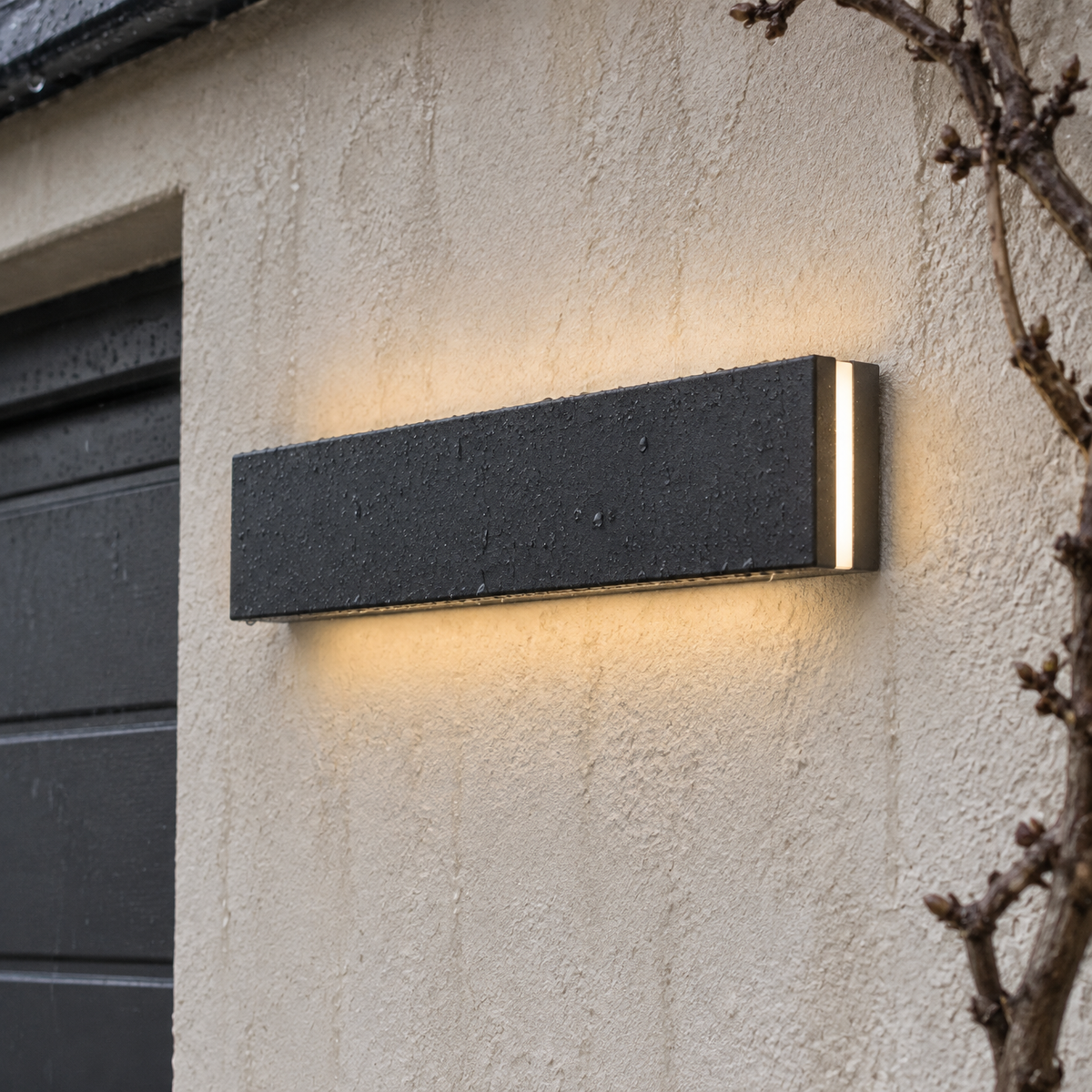 Waterproof linear LED outdoor wall sconce lit horizontally on rain-streaked render