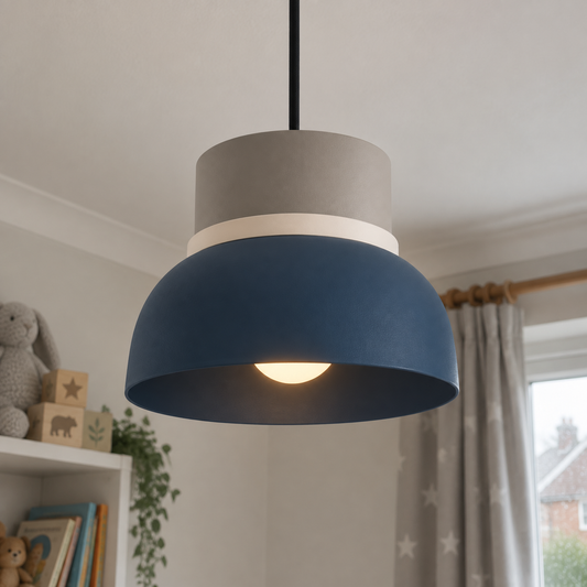 Pastel acrylic and metal pendant light hanging lit in a child's bedroom
