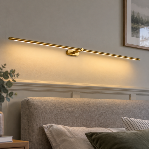 Cordless linear bedside wall lamp fixed horizontally above a headboard and switched on