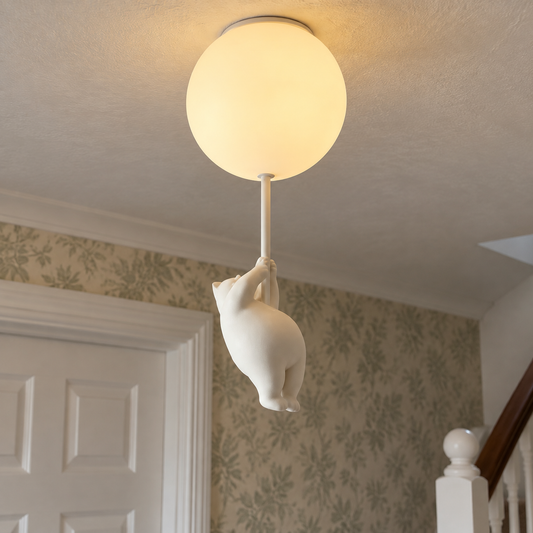Modern resin flush mount ceiling light switched on above a landing and panelled door