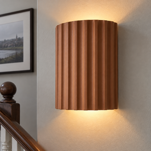 Nordic resin wall light fixed to a stairwell wall and switched on above a turned banister