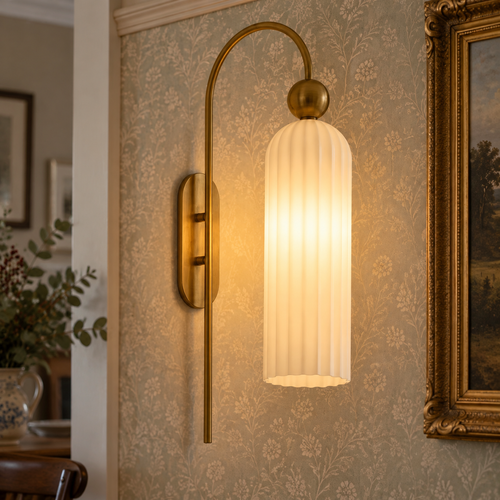 Antique cylinder ribbed glass wall sconce lit on a papered dining room wall
