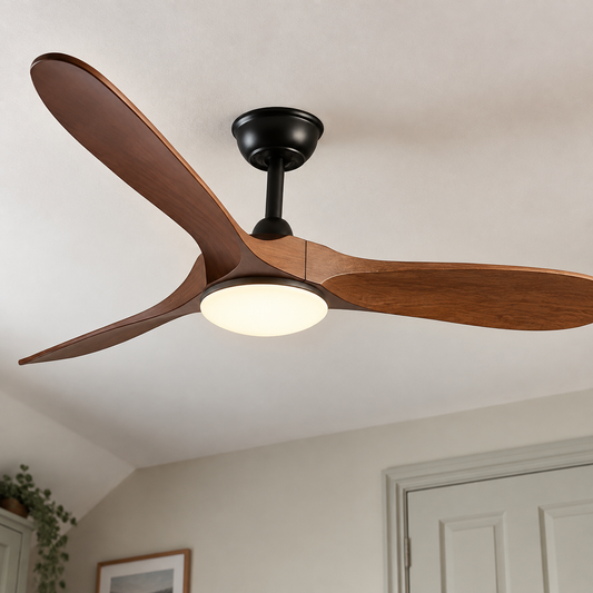 Scandinavian ceiling fan with an integrated light fitted to a bedroom ceiling on an overcast day