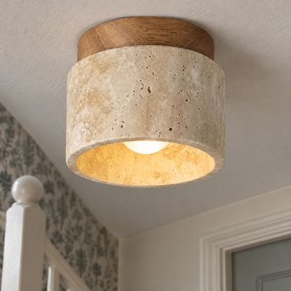 Slim LED ceiling lamp fitted flush above a painted stair bannister in a British stairwell