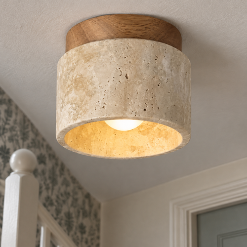 Slim LED ceiling lamp fitted flush above a painted stair bannister in a British stairwell