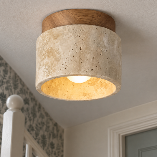 Slim LED ceiling lamp fitted flush above a painted stair bannister in a British stairwell