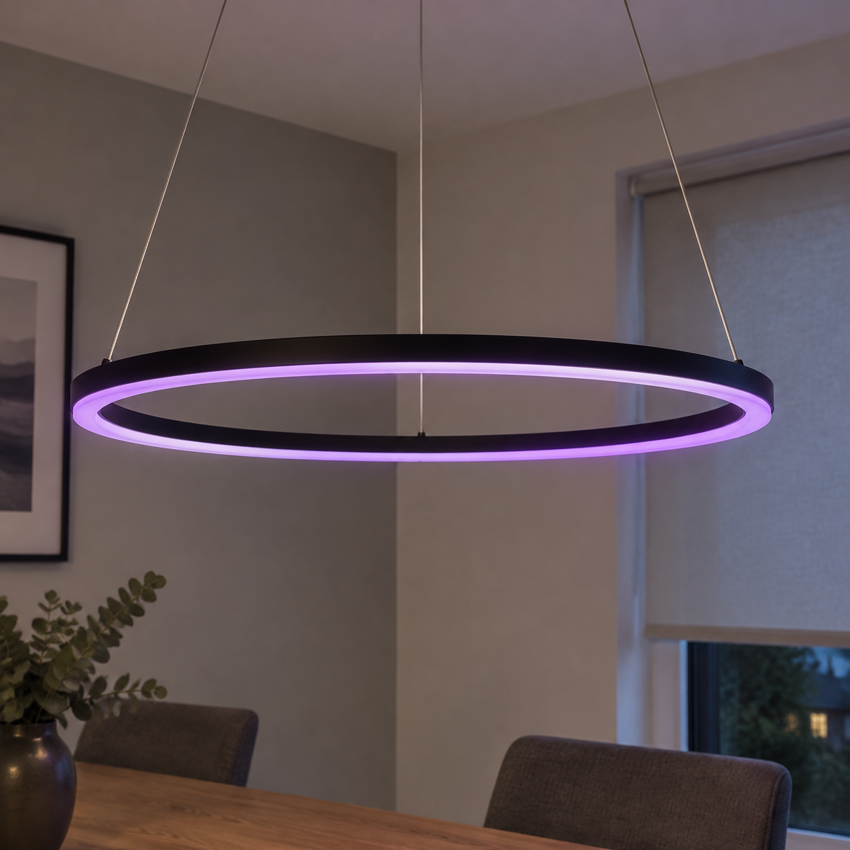 Black smart RGBW LED linear pendant light hanging level above a dining table