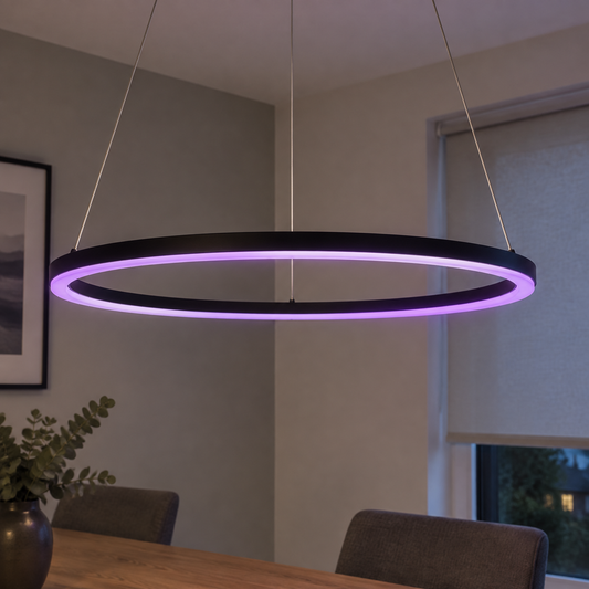 Black smart RGBW LED linear pendant light hanging level above a dining table