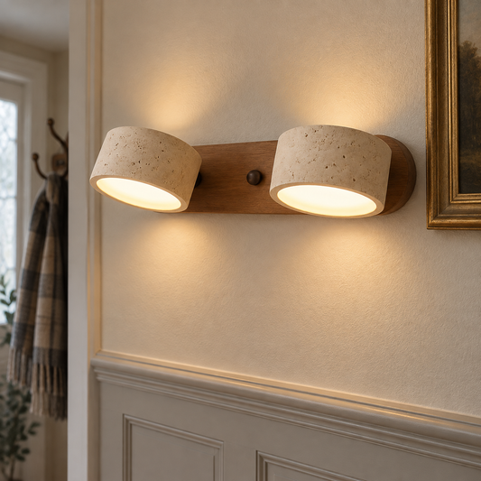 Travertine stone LED wall lamp mounted on a panelled hallway wall above a dado rail, glowing softly up and down the plaster