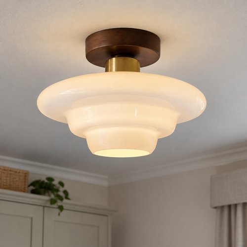 Scandinavian walnut and glass ceiling light fitted flush to a bedroom ceiling, warm wood frame with glass diffuser lit softly