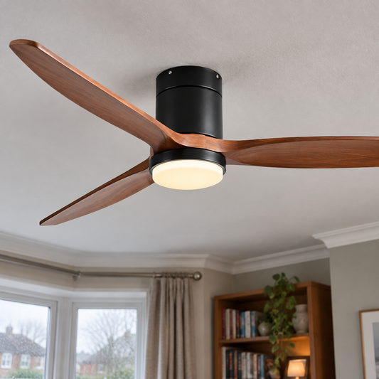 Wooden ceiling fan with light hanging level in a sitting room, wood-effect blades above a tall bookcase